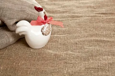 Ceramic figurine of easter chicken on a brown background Stock Photos