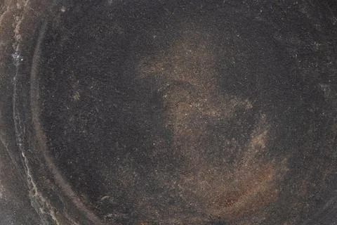 Ceramic flat plate with dark brown coating and dust and dirt stains, used f.. Stock Photos