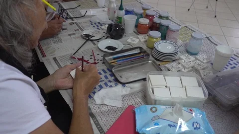 Ceramic glazing workshop in progress at the old people home Stock Footage 94674047