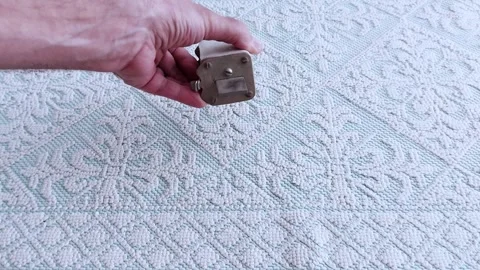 Ceramic High Voltage Fuse on Patterned Fabric- Industrial Close-Up Stock Footage 311695348