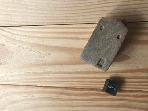 Ceramic house with home button of computer Stock Photos
