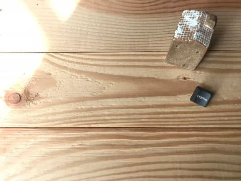 Ceramic house with home button of computer and beautiful sunlight Stock Photos