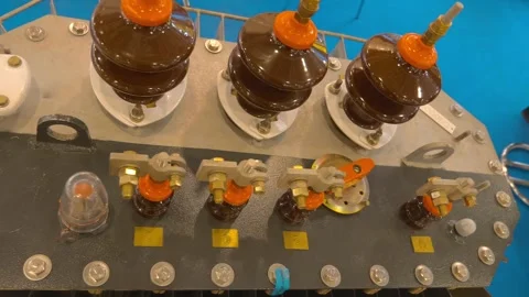 Ceramic insulators in high-voltage equipment are presented at the exhibition Stock-Footage 333395209