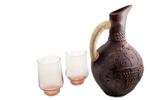 Ceramic jug for wine from red clay on a white background Stock Photos