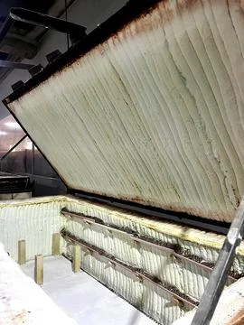 A ceramic kiln open, showcasing the inner chamber lined with insulation, read Stock Photos
