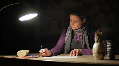 Ceramic maker designing artwork with pencil in her atelier Stock Footage 61949962