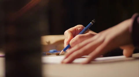 Ceramic maker designing artwork with pencil in her atelier extreme close-up Stock Footage 61950137