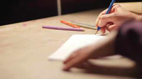 Ceramic maker designing artwork with pencil in her atelier extreme close-up Stockbeeldmateriaal 61950191
