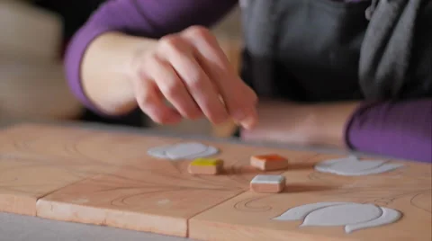 Ceramic maker selecting color samples close-up Stockbeeldmateriaal 61951747