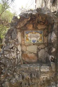 Ceramic memorial plaque set in stone shrine Stock Photos