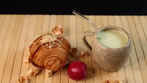 Ceramic mug filled with creamy vegetable beverage near croissant, autumn harvest Stock-Footage 288829166
