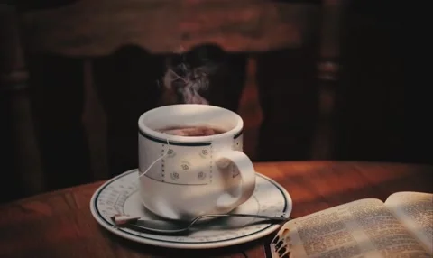 Ceramic Mug Tea Service with Steaming Liquid and Teabag 動画素材 339268032