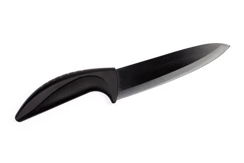 Ceramic multipurpose black kitchen knife on a white background Stock Photos