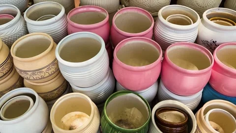 Ceramic planter collection featuring decorative patterns and pastel color Stock Footage 336537299