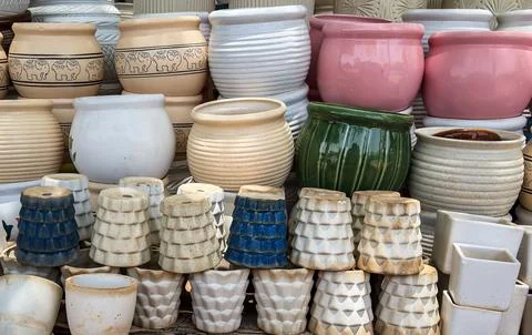 Ceramic planter collection featuring decorative patterns and pastel color d.. Stock Photos