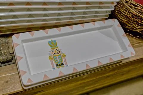 Ceramic Plate with Nutcracker Design and Geometric Border Foto stock