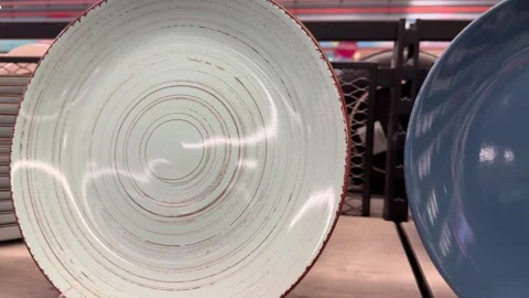 Ceramic plates and dishes displayed on store shelf Stock Footage 318014146