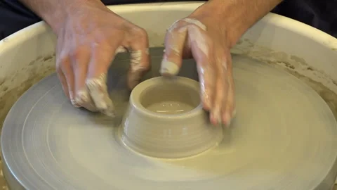 Ceramic pot on a potter's wheel. Making a ceramic pot Stock Footage 260508477