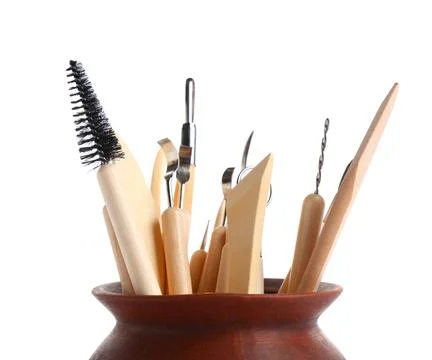 Ceramic pot with set of sculptor tools isolated on white background Stock Photos