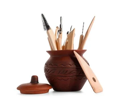 Ceramic pot with set of sculptor tools isolated on white background Stock Photos