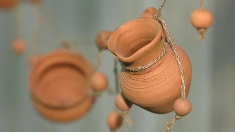 Ceramic pots hanging on the rope. Stock Footage 106775469