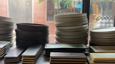 Ceramic products lying on shelf in pottery studio Stockbeeldmateriaal 278407959