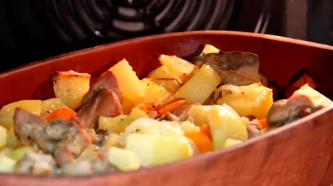 Ceramic sauce pot with stew meat in oven Stock Footage 43428771
