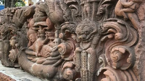 Ceramic sculpture in front of Buddhist temple in Thailand Stock Footage 48443306
