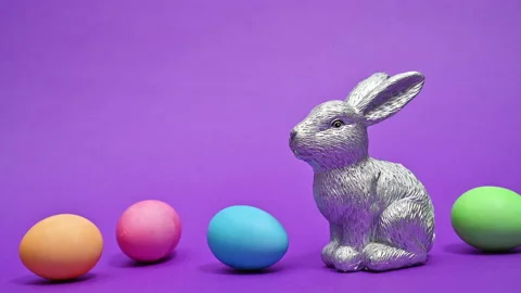 Ceramic silver Easter rabbit with colorful eggs appear. Stop motion Video stock 171675018