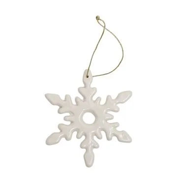 Ceramic snowflake ornament with golden string isolated on white background... Stock Photos