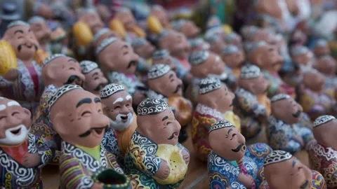 Ceramic souvenir figures of people in basic clothes. Uzbekistan Stock Footage 245548791