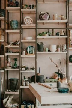 Ceramic studio for craft work with clay, color, glaze. Daylight in art loft Stock Photos