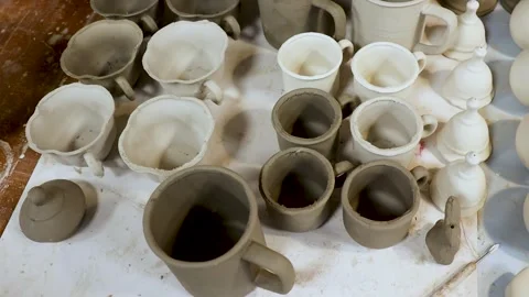 Ceramic studio workspace, showcasing handcrafted cups and pottery pieces Stock Footage 279985754