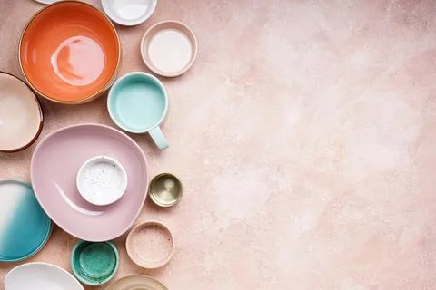 Ceramic tableware on beige background with space for text. Top view. Stock Photos