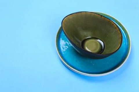Ceramic tableware on blue background Stock Photos