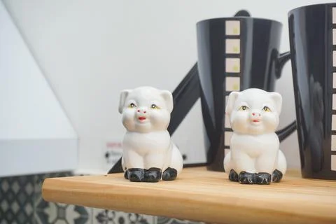 Ceramic tableware on the shelf in the kitchen Stock Photos