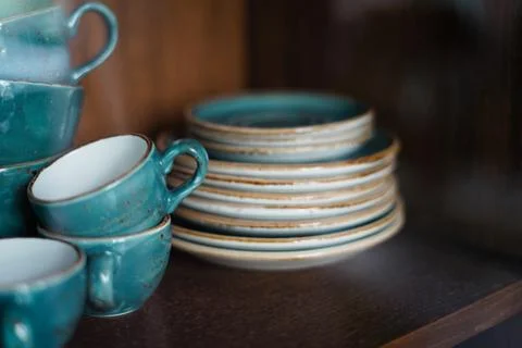 Ceramic tea cup in the cupboard Stock Photos