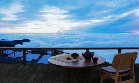 Ceramic tea set and dry tea leave on a wooden table and chair on the balcony  Stock Illustration