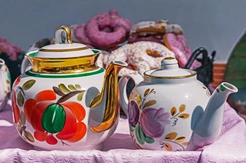 Ceramic teapots for brewing tea on the background of sweeties. Stock Photos