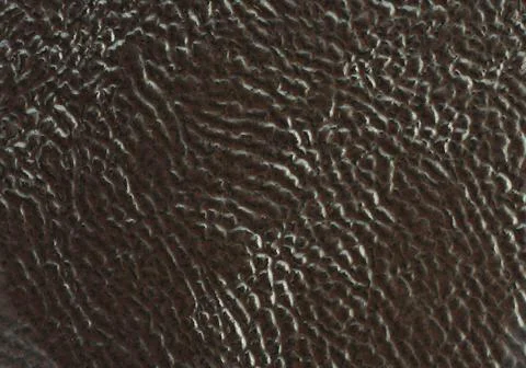 Ceramic tile brawn leather effect background. Closeup texture Stock Photos