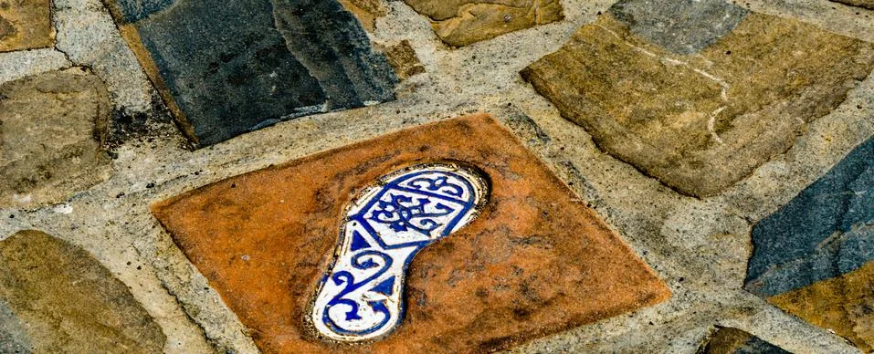 Ceramic tile with an element of reflection of the human foot, a decorative el Stock Photos