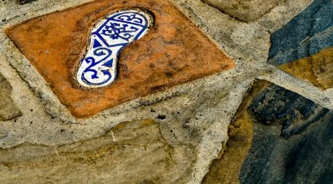 Ceramic tile with an element of reflection of the human foot, a decorative el Stock Photos