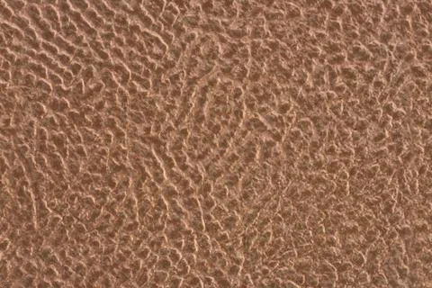 Ceramic tile light brown leather effect background. Closeup texture Stock Photos