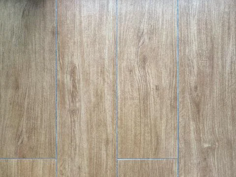 Ceramic tile with a pattern under the parquet Stock Photos