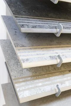 Ceramic Tile Samples Display on Rack in Modern Hardware Showroom. Interior Stock Photos