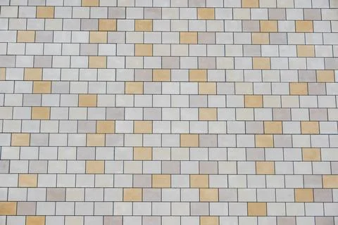 Ceramic tile wall background displaying beige and cream rectangular patterns Stock Photos