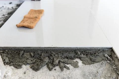 Ceramic tiles and cement mortar before laying tile, building construction. Fotos de archivo