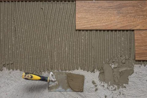 Ceramic tiles and tools for tiler. Floor tiles installation. Stock Photos