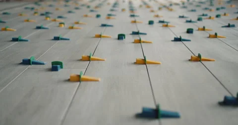 Ceramic tiles are glued to the floor in even rows Stock-Footage 152926249