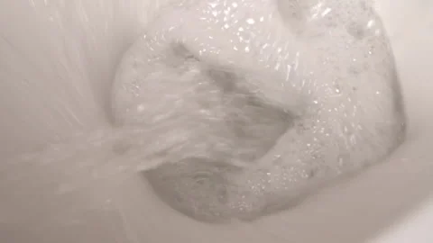 Ceramic Toilet During a Flush, Close-up from Above Stock Footage 211811688